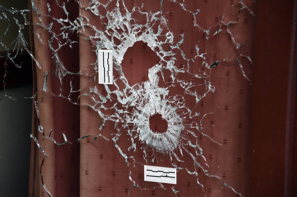 DOMINIQUE FAGET/GETTY IMAGES Bullet holes scar the windows of the Carillon and the adjacent Cambodian restaurant on Rue Alibert in the 10th district of the French capital Paris, on Nov.14, 2015, the morning after an attack that killed 12 people at the restaurant.