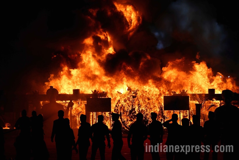 A massive fire broke out on Sunday evening during a cultural programme at Make In India week event in Mumbai. The fire broke out below the stage during the programme.Maharashtra chief minister Devendra Fadnavis and governor C Vidyasagar Rao who were present during the programme were quickly moved out of the area. Express photo by Prashant Nadkar,Mumbai, 14/02/2016