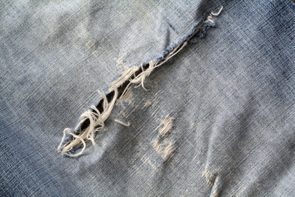 Frayed and torn old jeans